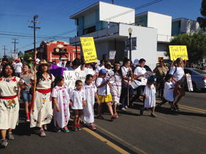 A Trail for Humanity's walkers and supporters march through Barrio Logan.