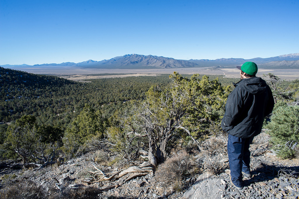 Will Falk looks out across both natural and highly-impacted lands in Cave Valley, Nevada.