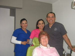 Dr. Garcia & staff with Judy