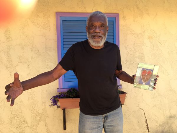 Man holding a stained glass heart